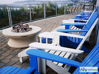fire pit and Adirondack chairs on Sam's outdoor patio